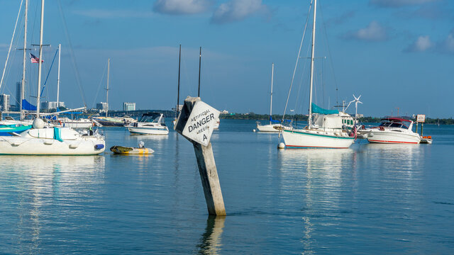 Boats in Marina with Artificial Reef Warning Sign 