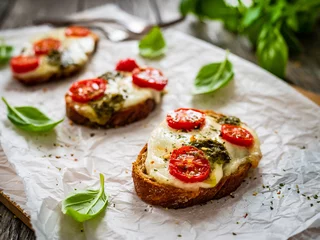 Rollo Brot Tasty sandwiches - baked bread with mozzarella, basil pesto and cherry tomatoes  © Jacek Chabraszewski