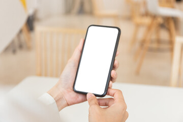 cell phone blank white screen mockup.woman hand holding texting using mobile on desk at office.background empty space for advertise.work people contact marketing business,technology