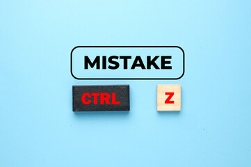 A picture of mistake word with control word at black wooden block and Z at word tiles. Real life has no Ctrl Z.