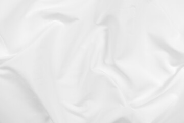 Abstract white fabric texture background. Cloth soft wave. Creases of satin, silk, and cotton.