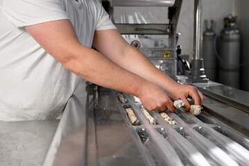 Sausages. Packing line of sausages. Industrial manufacture of sausage products. High quality photo.