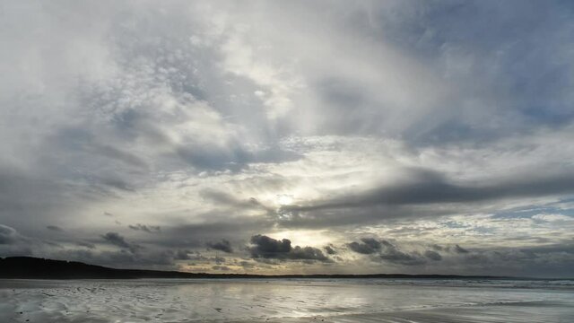 Plage du Ris close to Douarnenez on the West coast of Brittany, France. Time lapse of winter clouds and the sea.