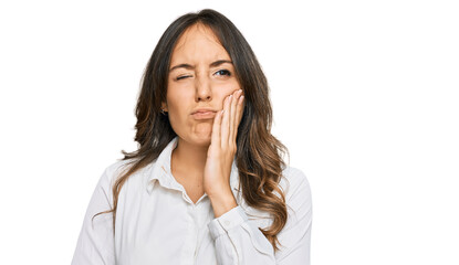 Fototapeta premium Young brunette woman wearing casual clothes touching mouth with hand with painful expression because of toothache or dental illness on teeth. dentist
