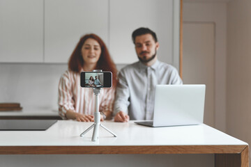 Front view of family couple working with laptop and conduct online learning