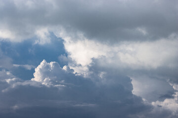 Fototapeta na wymiar Dark cloudy sky with soft sun reflection