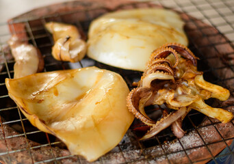 Squid grilled on the brazier. Grilled squid. BBQ