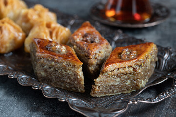 Traditional middle eastern sweets baklava on decorative tray