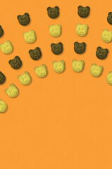 Bear cookies pattern on orange background.