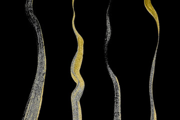Collection of various hand drawing golden paint brush strokes isolated on black background