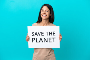 Young woman over isolated background holding a placard with text Save the Planet with happy expression