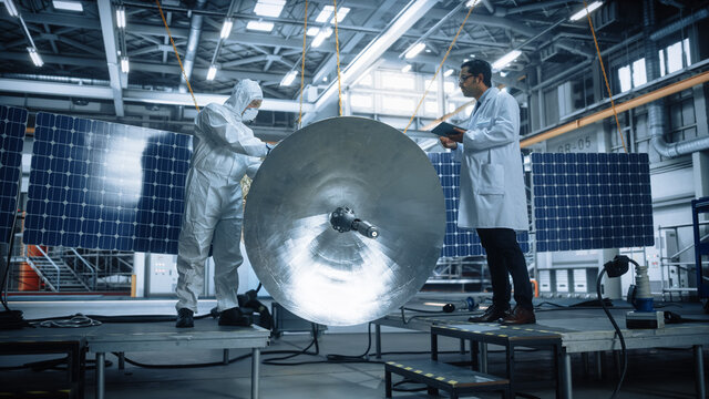 Team of Engineers Working on Satellite Construction. Aerospace Agency: Diverse Group of Scientists Developing Spacecraft for Space Exploration, Navigation, Communications, Cosmos Observation 