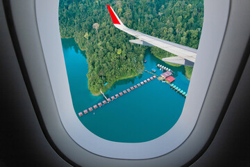 Plane window. Rajjaprabha Dam (Chiao Lan Dam), Surat Thani Province, Thailand mountain view, landscape outside window plane