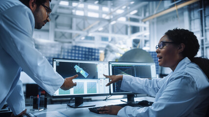 Managing Engineer and Chief Technician Working on Satellite Construction, Talk, Use Computer....