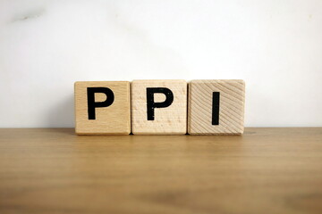 Ppi payment protection insurance abbreviation from wooden blocks