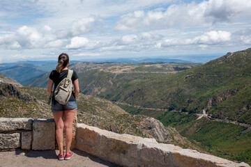 Naklejka premium Serra da Estrela in Portugal, a woman admiring the landscape