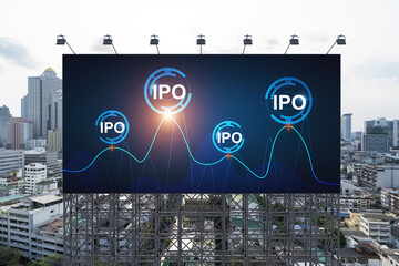 IPO icon hologram on road billboard over day time panorama city view of Bangkok. The hub of initial...