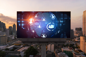 World planet Earth map hologram of social media icons over sunset panoramic cityscape of Bangkok, Southeast Asia. The concept of people connections.
