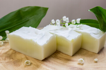 extract of May lily of the valley oil with plant and flower. Natural soap from scratch, handmade.