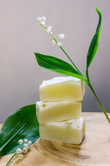 extract of May lily of the valley oil with plant and flower. Natural soap from scratch, handmade.