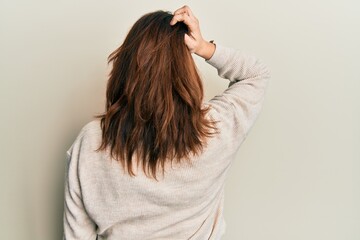 Fototapeta premium Young caucasian woman wearing casual clothes backwards thinking about doubt with hand on head