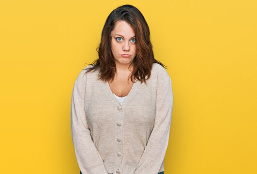 Young plus size woman wearing casual clothes depressed and worry for distress, crying angry and afraid. sad expression.