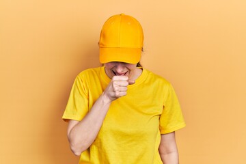 Young hispanic woman wearing delivery uniform and cap feeling unwell and coughing as symptom for cold or bronchitis. health care concept.