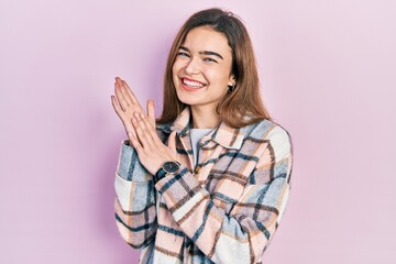 Young caucasian girl wearing casual clothes clapping and applauding happy and joyful, smiling proud hands together