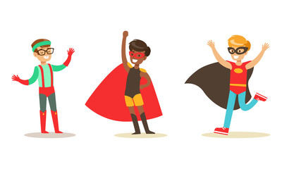 Fototapeta premium Set of Happy Boys and Girls in Superhero Costumes, Super Kids Having Fun at Masquerade Party Cartoon Vector Illustration