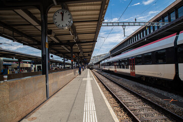 A train standing at railway station platform  in Europe