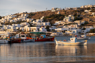 Fototapeta na wymiar Greek fishing boats in Mykonos island port. Cyclades, Greece