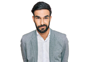 Young hispanic man wearing business clothes looking sleepy and tired, exhausted for fatigue and...