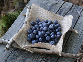 Blueberries on burlap.Blueberries on a wooden background