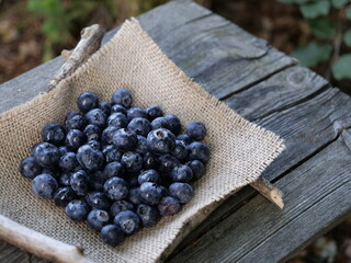 Blueberries on burlap.Blueberries on a wooden background