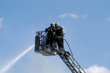 fire department emergency response with a turntable ladder