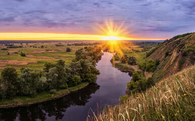 beautiful summer landscape sunrise over river with green meadow