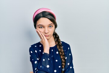 Young brunette girl wearing elegant look thinking looking tired and bored with depression problems with crossed arms.