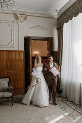 happy bride and groom go out after marriage