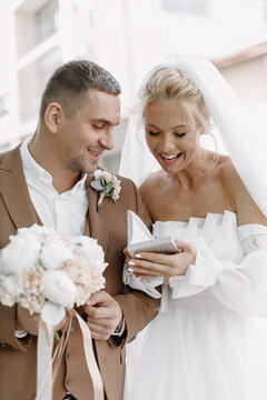 The Groom Gives The Bride A Gift On The Street