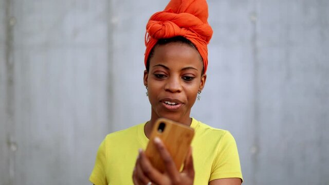Young woman using smart phone outdoors
