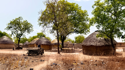African village in bush Ghana real life huts. Northern region of Ghana. Rural traditional mud and straw huts and buildings. Poverty economy. African tribal and native homes. © Donley Despain