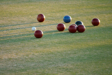 lawn bowling or bocce ball in afternoon light