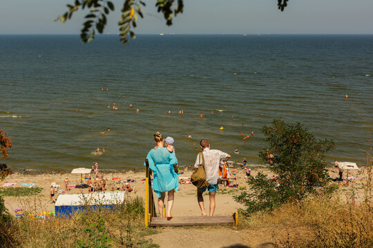 RUSSIA, YEYSK - 20 August 2016: Wooden stairs to the Kamenka beach with people. Russia, Sea of Azov, Krasnodar Territory, Yeysk.