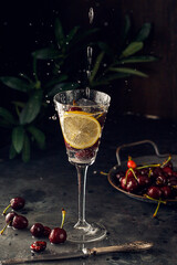 cocktail with lime and cherry