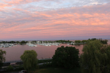 sunset over marina bay lake ontario
