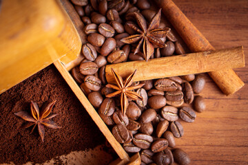 Vintage classic antique italy german hand manual ground coffee grinder powder of organic roasted espresso bean cinnamon star anise aroma in retro old wooden rustic homemade cafe shop barista style