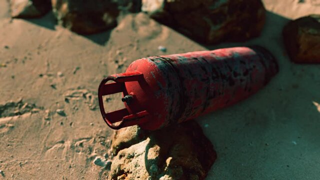 old rusted gas tank on sand beach