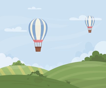 A Hot air balloon in the sky over a green field. Vector