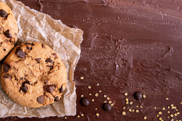 Organic food snack tasty sweet dessert milk dark chocolate chip salt cookie closeup piece fruit orange raspberry hazelnut nuts cinnamon on cocoa cacao powder wooden table for new year Christmas gift