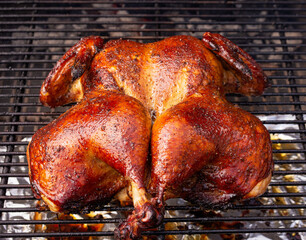 grilled whole spatchcock chicken on grill © Tamela